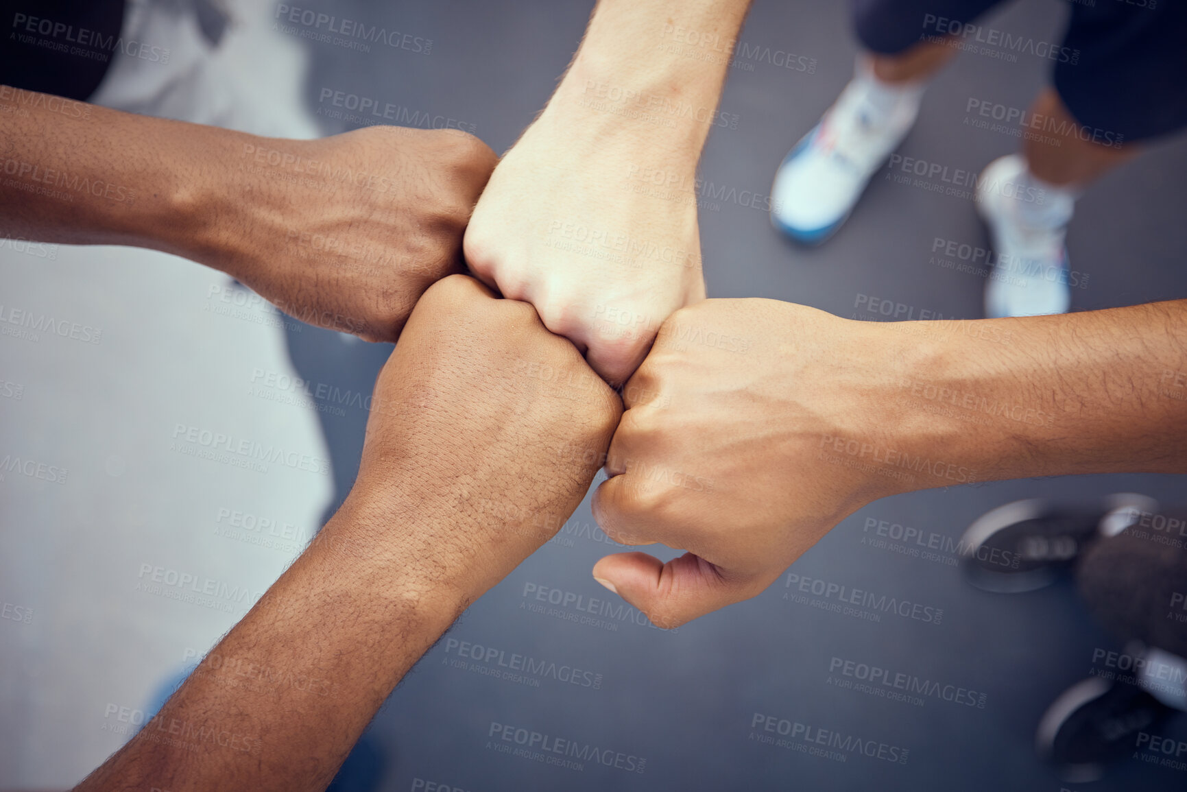 Buy stock photo Teamwork, hands and collaboration with people standing in a circle or huddle in support, unity or solidarity. Team, group of community with fists joined in union together from above and closeup