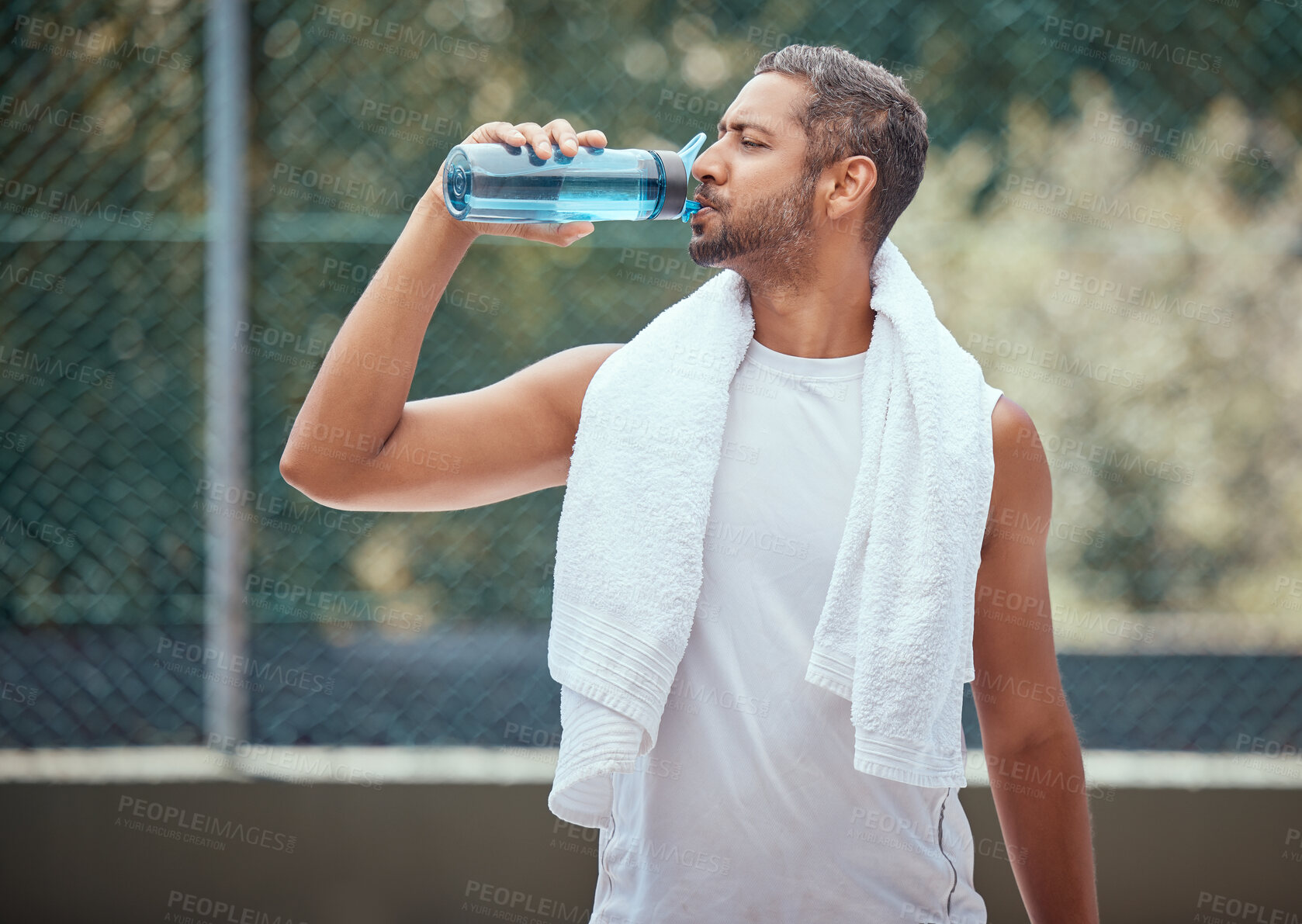 Buy stock photo Sports, fitness and man on break drinking water after a workout, training session or exercise. Health, athlete and male trainer resting with refreshing liquid after playing a sport, running or cardio