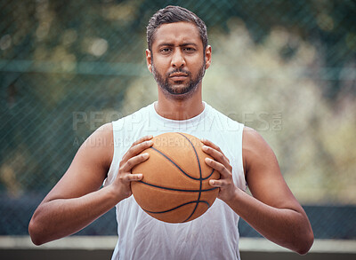 Buy stock photo Basketball court, man and serious portrait with ball in outdoor sports venue for practice. Competitive, strong and mature athlete male thinking of a game play strategy for outside match.