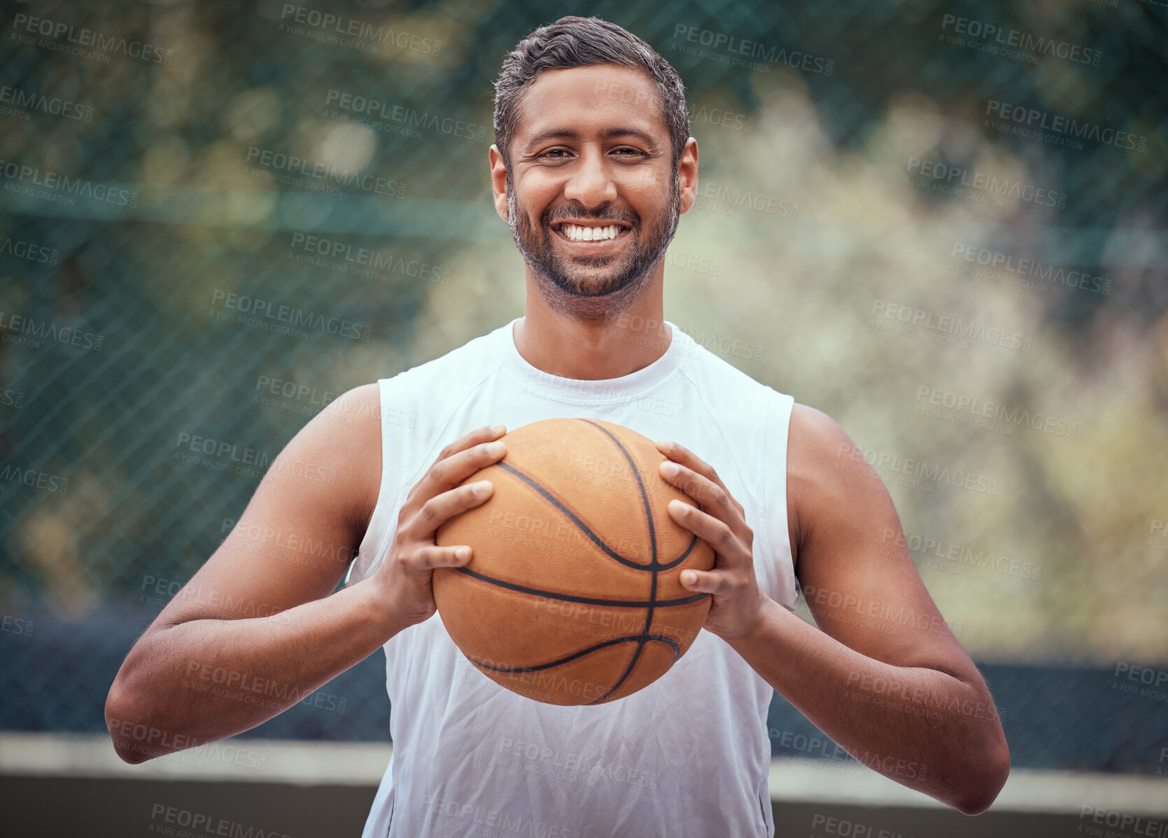 Buy stock photo Basketball player, athlete and sports man with ball, skill and hobby for playing game, fun match or competition outdoors. Portrait of happy, fitness and indian man, goal motivation and ready to win