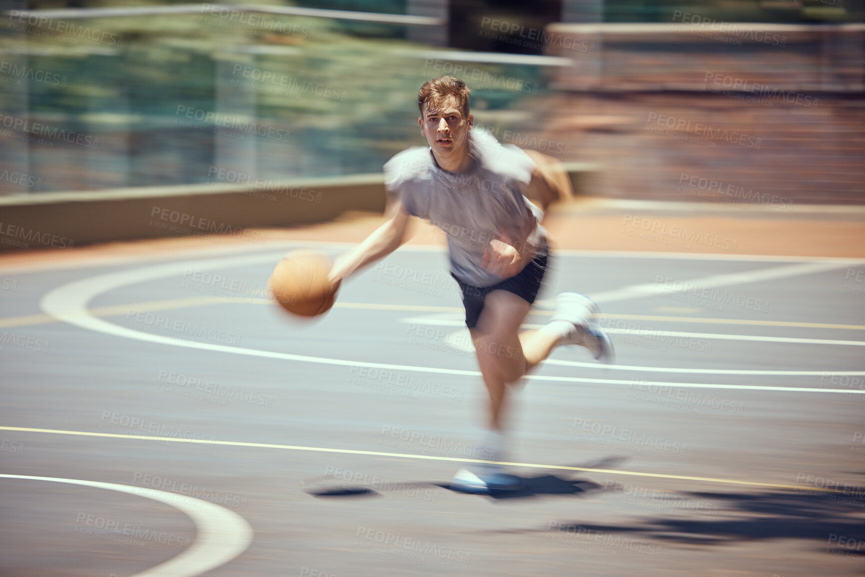 Buy stock photo Basketball player, sports and training with a active, fit and fast man playing a game at an outdoor court. Professional athlete doing exercise for health and wellness during practice for a match