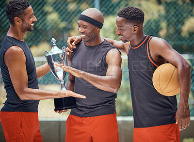 Buy stock photo Award, success and basketball athletes with a trophy as a reward or prize after winning a competitive sports game. Challenge, fitness and happy African winners in celebration after mens championship