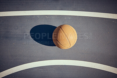 Buy stock photo Basketball, empty game court and sports ball ready for sport exercise and health training. Top view of orange workout fitness tool for fun team sport with a light shining casting a shadow on a floor