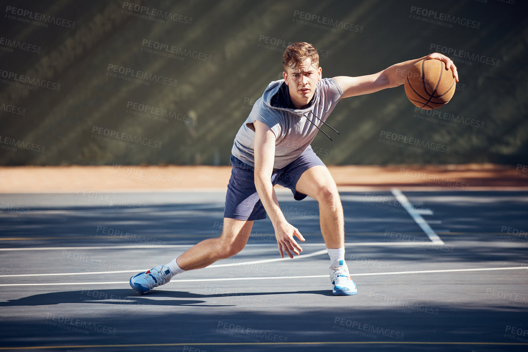 Buy stock photo Portrait, sport and basketball man on court in training, practice or game. Health, exercise and workout male athlete showing off skills, getting ready for sports competition or tournament outside.

 