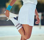 Stretching exercise, sports and tennis woman standing to stretch her legs as warmup during practice or training for a match or game. Closeup of fit and active female playing at an outdoor court