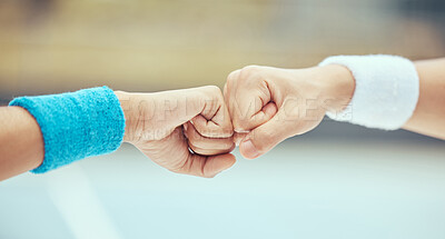 Buy stock photo Fist bump, celebration of sport success and motivation hands for tennis player on court for sports game, support during competition and team collaboration. Partnership, trust and goal in training