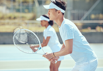 Buy stock photo Asian tennis man with racket and training, practice or play game on a court. Serious, focused fitness athletes together playing competitive double match as team to stay fit and healthy in sports club