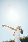 Tennis court, outdoor girl and ball in sky after professional hit  with sports racket in match. Woman champion, competition and talented and fit athlete person with expert game play technique.