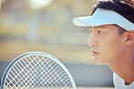 Tennis, sports and exercise focus of a Asian man athlete in a sport, training or fitness game. Player from Japan with a competitive mindset feeling healthy, strong and ready to start a workout match