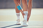 Tennis athlete with ankle injury, pain and hurt on a court after training, workout or practice outdoor. Professional sport person with accident after fitness exercise, game or match at a sports club