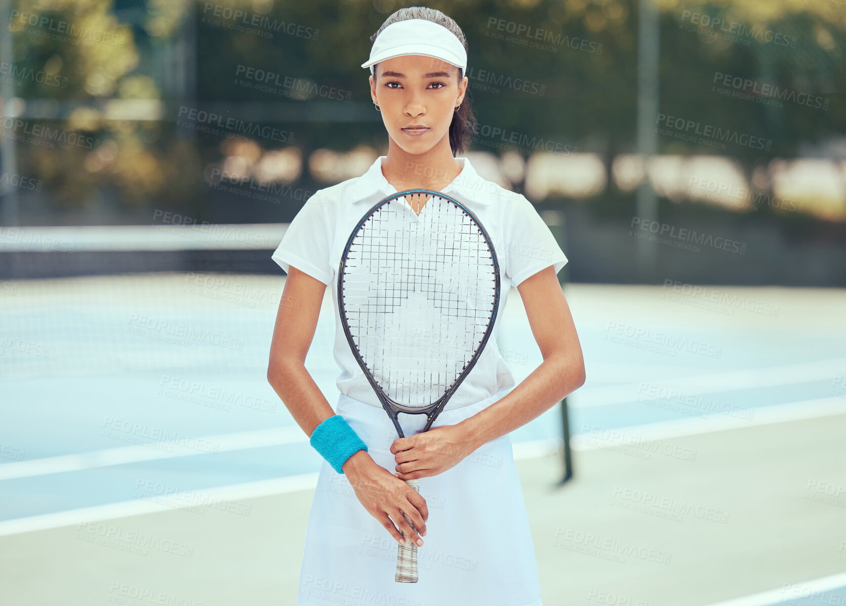 Buy stock photo Tennis player, athlete and sports woman training and practising for a match of game with a racket on an outdoor court. Serious, active and fitness girl ready for wellness, exercise and competition