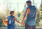 Basketball, family and sport with a dad and son training on a court outside for fitness and fun. Children, exercise and workout with a father and boy playing basket ball for health and recreation