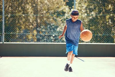 Buy stock photo Sports, athlete and child basketball player training for a match on an outdoor court in nature. Exercise, workout and healthy boy practicing his skill for a game on a professional field.