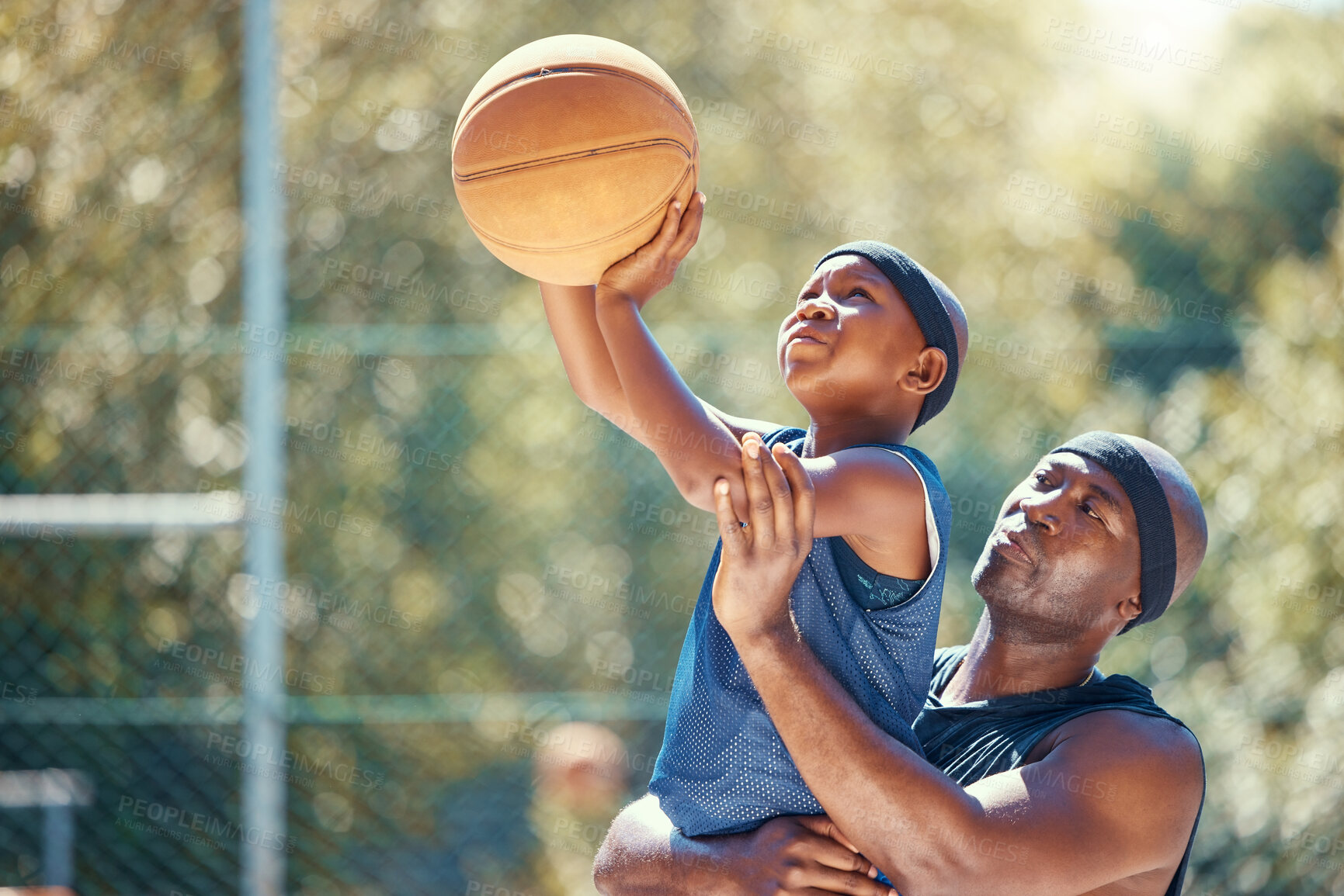 Buy stock photo Family basketball, sports father and child, support while training kid in on court in summer, help learning sport game and teaching young athlete. Motivation dad helping African sports person