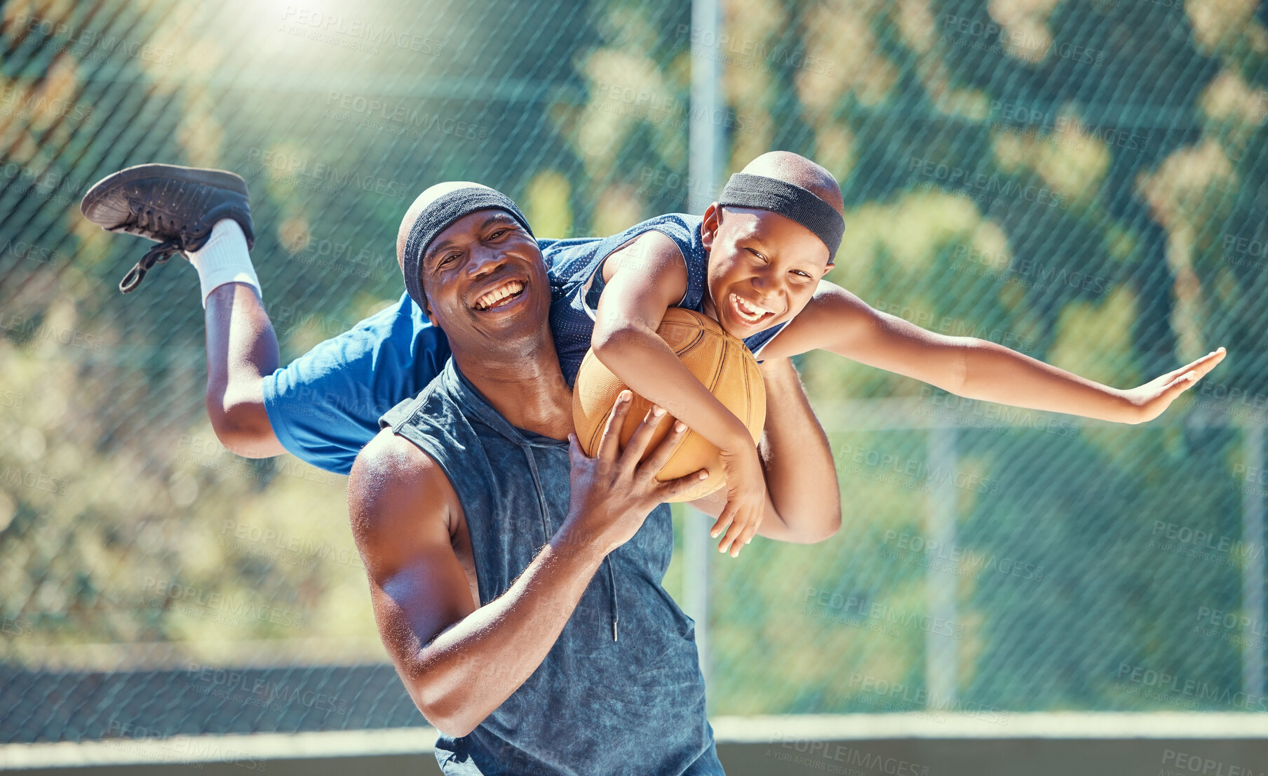 Buy stock photo Basketball court, father and child smile together with playful and funny moment in game together. Happy, fun and healthy black family have outdoor bonding time in sports exercise break.