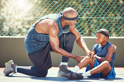 Buy stock photo Basketball knee injury kid with dad put emergency band aid for sports training game accident at basketball court. African black father and injured child team with healing leg pain and wound plaster