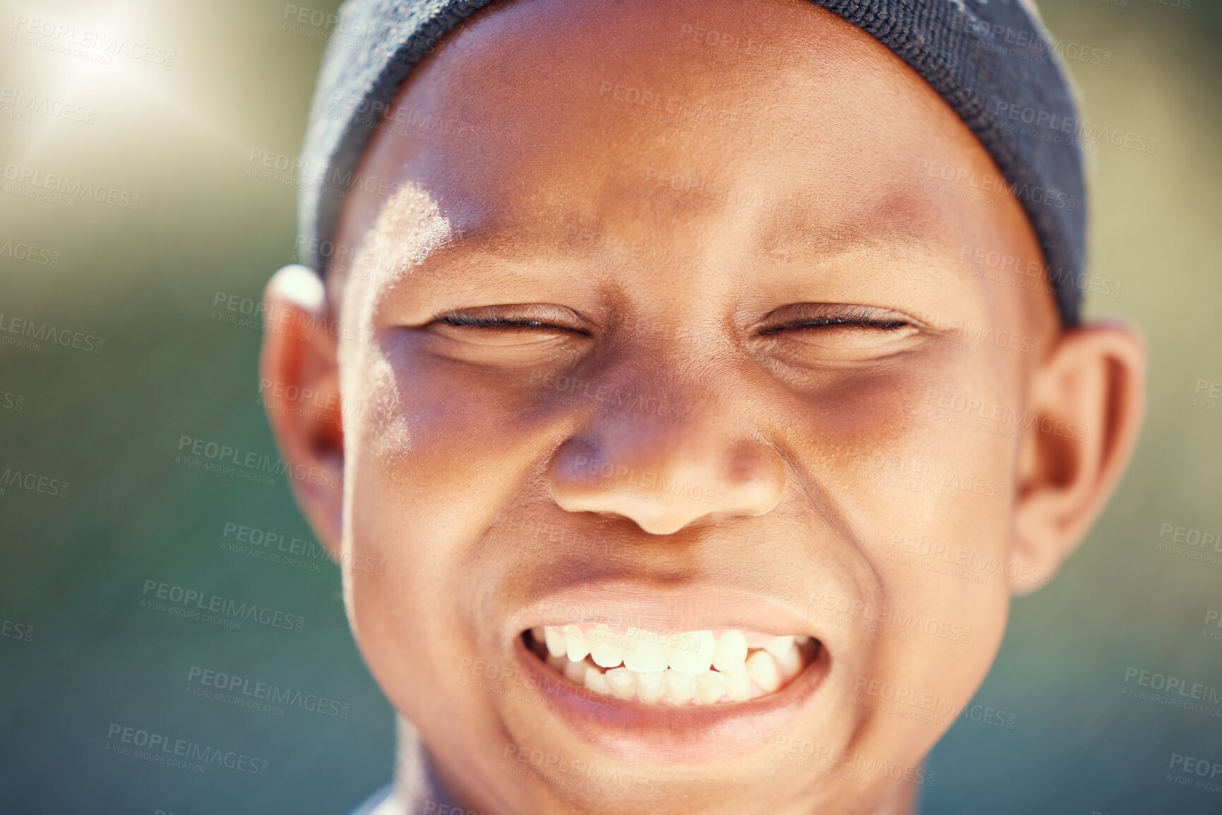 Buy stock photo Children, face and teeth with a black boy outside with a big smile and eyes closed. Kids, head and joy with a carefree little male child standing outdoors alone with flare and a positive expression