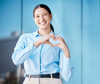 Buy stock photo Heart, love and health with the hands of a business woman making a gesture with a smile outside in the city. Portrait of a corporate female employee showing affection and standing alone outdoors