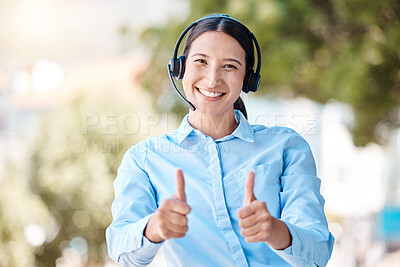 Buy stock photo Thumbs up, customer service and happy woman standing outside with a headset and a positive and friendly attitude. Portrait of CRM, telemarketing and call center operator showing support and thank you