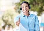Thumbs up for success, call center support and woman working at crm telemarketing company in city, employee agreement and consultant thank you. Portrait of happy and smile customer service worker