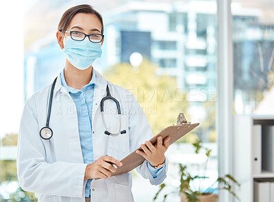 Buy stock photo Medical doctor, covid hospital office and healthcare worker with face mask. Consulting clinical medicine advice, corona virus results on clipboard and nurse working in professional protection. 