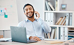 Happy businessman on a phone call while working on a laptop at the desk in his modern office. Corporate, professional and company manager laughing while having a mobile conversation with technology.