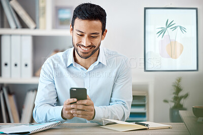 Buy stock photo Phone, communication and schedule with a business man working in his office with wifi and mobile technology. Email, networking and text message with a young male employee at his desk at work