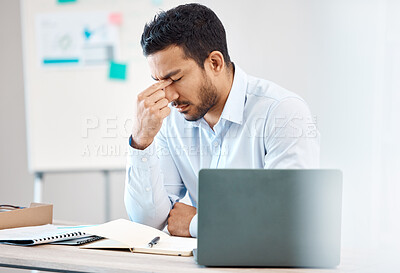 Buy stock photo Tired, headache and eye strain from laptop with businessman while writing in notebook in corporate company. Stress, burnout and fatigue with young professional male at desk in office building 