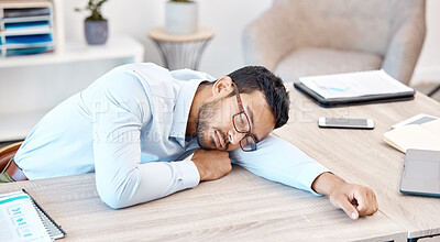 Buy stock photo Burnout, sleeping and tired with an overworked business man asleep at his desk in the office. Exhausted, fatigue and dreaming with a young male employee napping on a table at work after working late