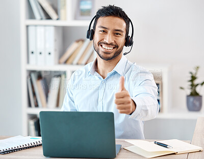 Buy stock photo Thumbs up, customer service and call center with a man saying yes while working in telemarketing and sales. Motivation, crm and contact us with a male employee saying thank you while consulting