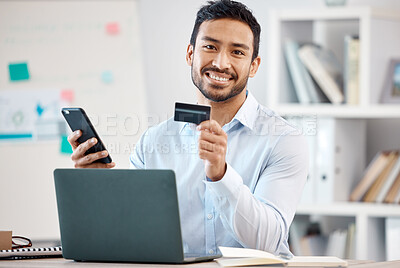 Buy stock photo Credit card, phone payment and businessman shopping on the internet, banking on mobile app and working in finance in work office. Portrait of smile Asian employee using online retail service on web