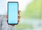 Mockup phone, blank space and blue mobile screen in a hand of a business woman for advertising or marketing. 5g network and wireless technology for a brand logo, internet app or contact us website