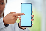Hand of business woman with mockup phone for contact us advertising of 5g network company with blue screen copy space. Corporate black woman working in marketing field pointing at digital mobile tech