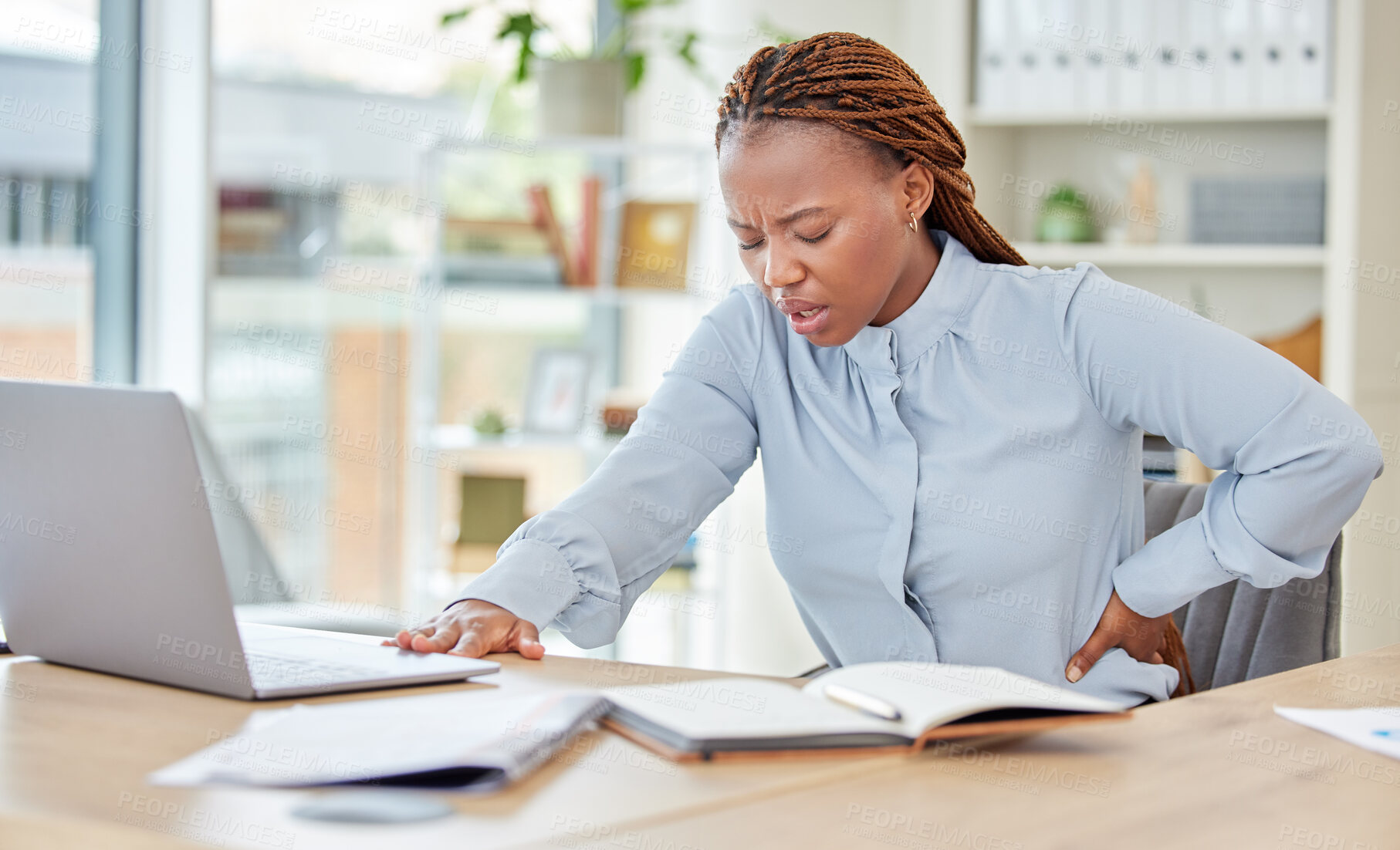 Buy stock photo Business black woman, back pain and health stress, risk and muscle injury at modern office workplace desk job. Young african american, uncomfortable spine problem and bad sitting posture for working