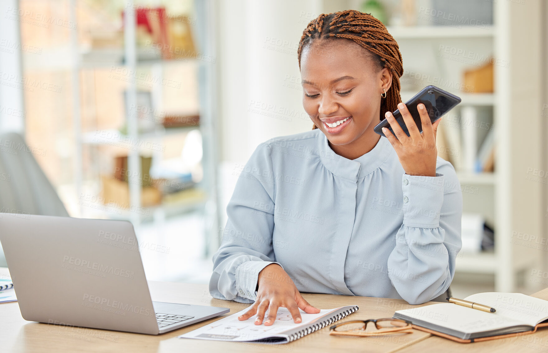 Buy stock photo Professional business woman with phone call reading notebook on her laptop computer in modern office. Woman corporate employee sitting at desk talking on smartphone at table in a startup company