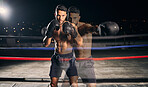 Fitness, boxing and boxer in the ring training, exercise and punching with energy and power in a workout portrait. Action, performance and healthy man fighting to be a young sports champion athlete 