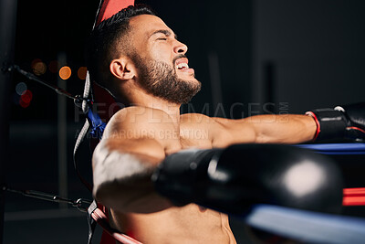Buy stock photo Boxing, pain and tired boxer in the ring fighting in a sports arena or stadium for a competitive championship. Fitness, exercise and intense training workout by a young Latino fighter with an injury