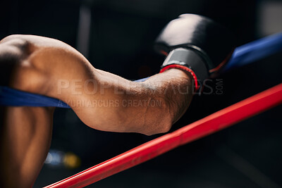 Buy stock photo Sports, fight and hand of a boxing man resting in the corner of a boxing ring during an exhibition match, exercise or workout. Motivation, fitness and training boxer relax and tired after fighting