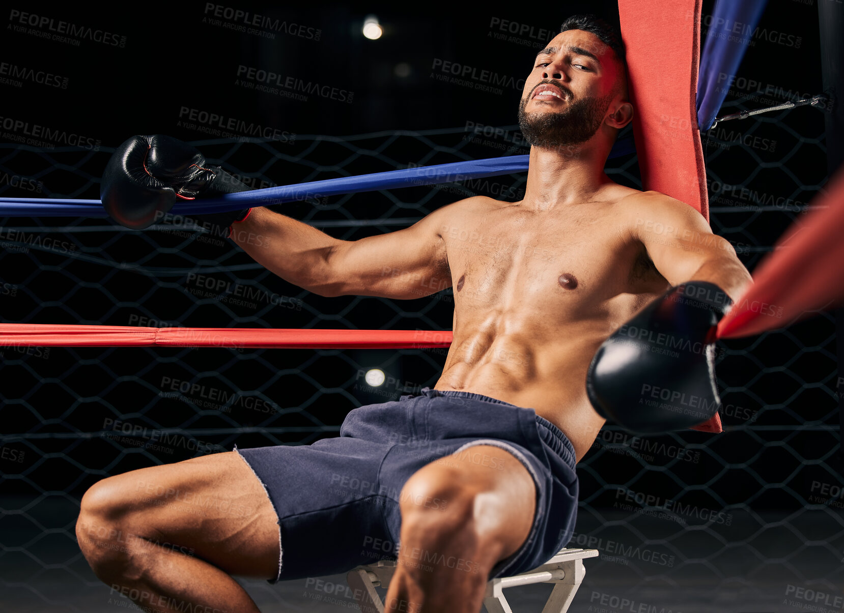 Buy stock photo Fitness, boxer and man tired in ring out corner exhausted from sports boxing match at the gym or arena. Active male in fight club, fatigue and relaxing from intense fighting sport workout or exercise