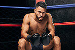 Fitness, motivation and boxing man in competition ring fight at wellness gym for health exercise, training and workout. Background portrait of tired boxer with vision, winner mindset or sports goals