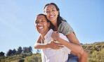 Love, happy couple and travel adventure with young lovers out hiking, exploring and traveling through nature in summer. Portrait smile of latino man and woman enjoying piggyback while out for a walk