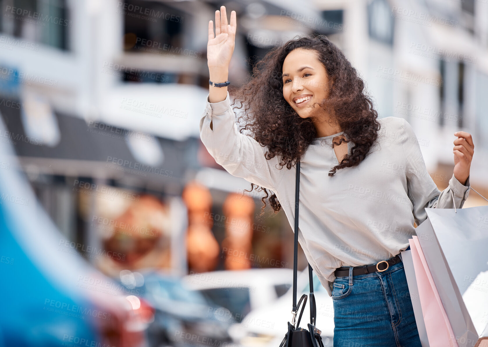 Buy stock photo Urban woman, calling taxi and retail bags after positive shopping trip in a busy city. Young girl in the street with store purchase packages while looking for transport service in town.