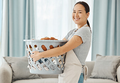 Buy stock photo Happy Asian cleaner woman with laundry working for home, house or hotel hospitality cleaning help service agency. Japanese girl maid or worker smile in apartment with dirty clothes in washing basket