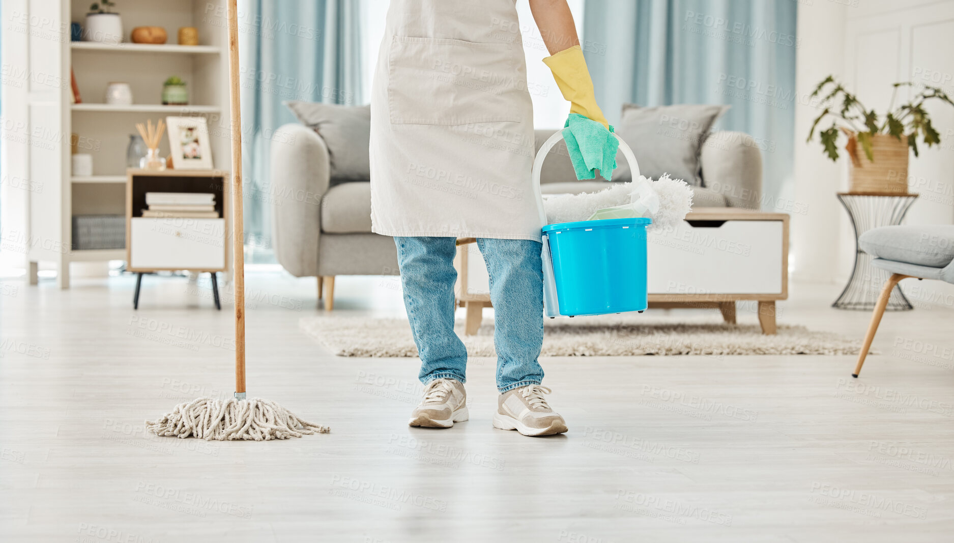 Buy stock photo Cleaning, mop and spring cleaning equipment with woman in living room for domestic, hygiene and sanitary. Maid or housekeeper with container in home for interior, house or apartment cleaning service