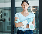 Portrait of a woman cleaner with gloves and detergent standing ready to clean office building. Happy, smile and proud maid with her spray bottle for hygiene, cleaning and to disinfect the workplace.