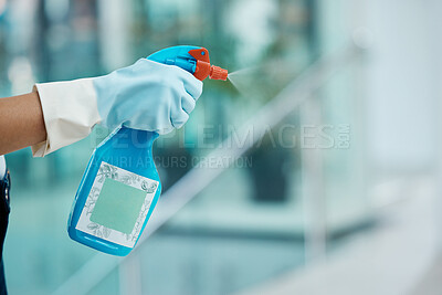 Buy stock photo Covid, cleaning and sanitizing with the hands of a woman cleaner in gloves holding a spray bottle to clean and wash an office with sanitizer. Hygiene, spraying and washing with an alcoholic liquid 