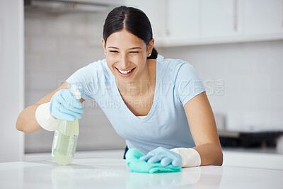 Buy stock photo Happy woman cleaning home kitchen, spray product cleaner with safety gloves and polish table with cloth. Domestic happiness, young girl disinfect counter with sanitary detergent and tidy apartment