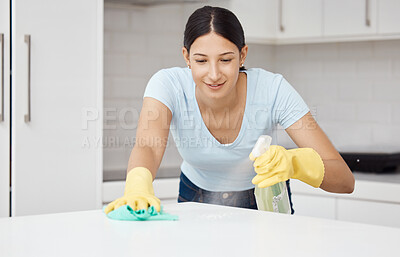 Buy stock photo Cleaning service, table and cleaner in the kitchen working with spray bottle to scrub messy dirt with a cloth and soap detergent. Happy, woman and employee on housekeeping job in gloves with products