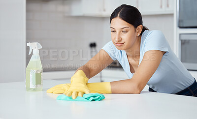 Buy stock photo Cleaner woman cleaning kitchen counter with cloth, spray bottle and rubber gloves in modern home interior. Service worker working with soap liquid, hygiene equipment or wipe surface for spring clean