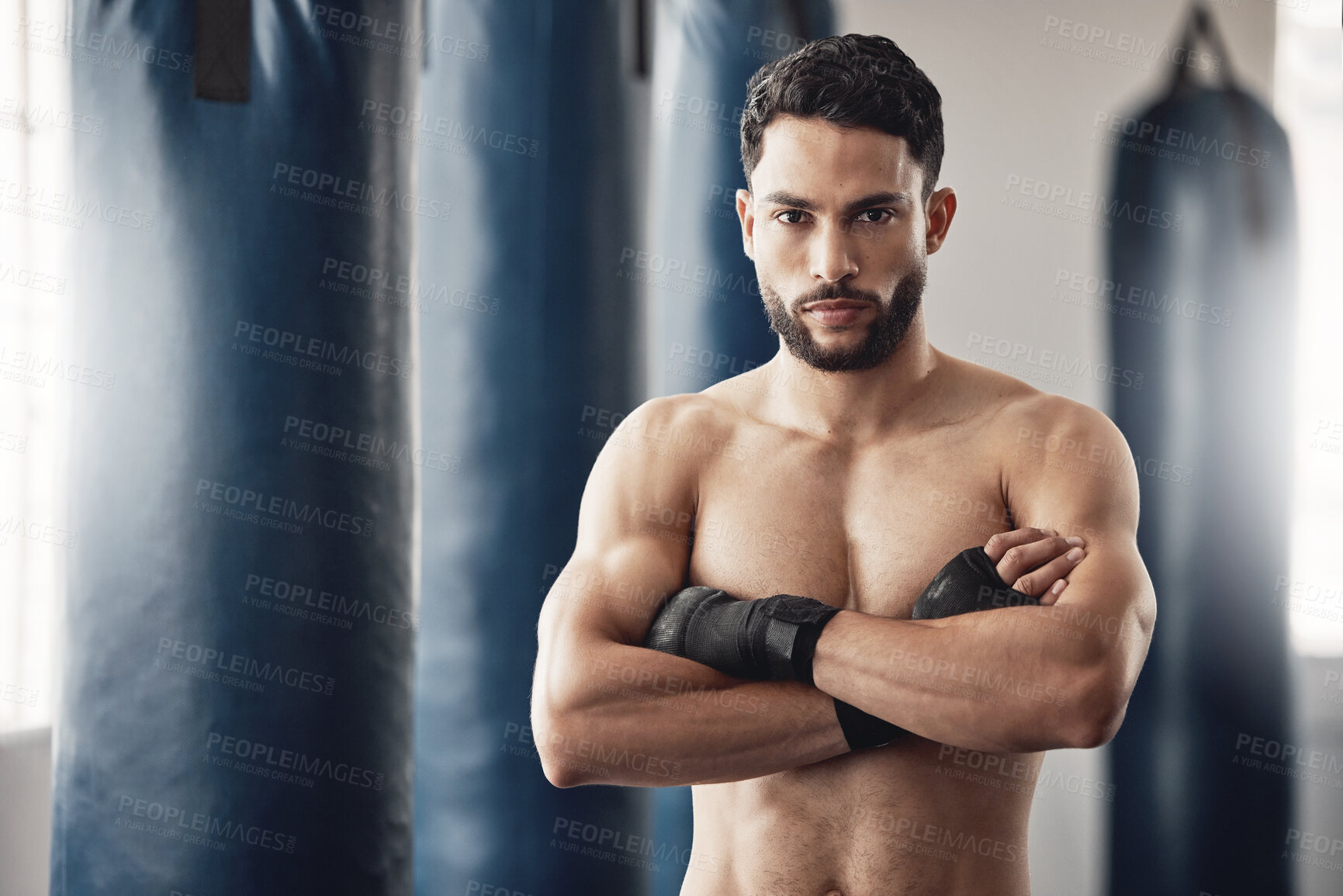 Buy stock photo Fitness, boxer and gym of a man in sports professional for strength and motivation with arms crossed. Portrait of a male in strong and confident boxing at health club by punching bag after training